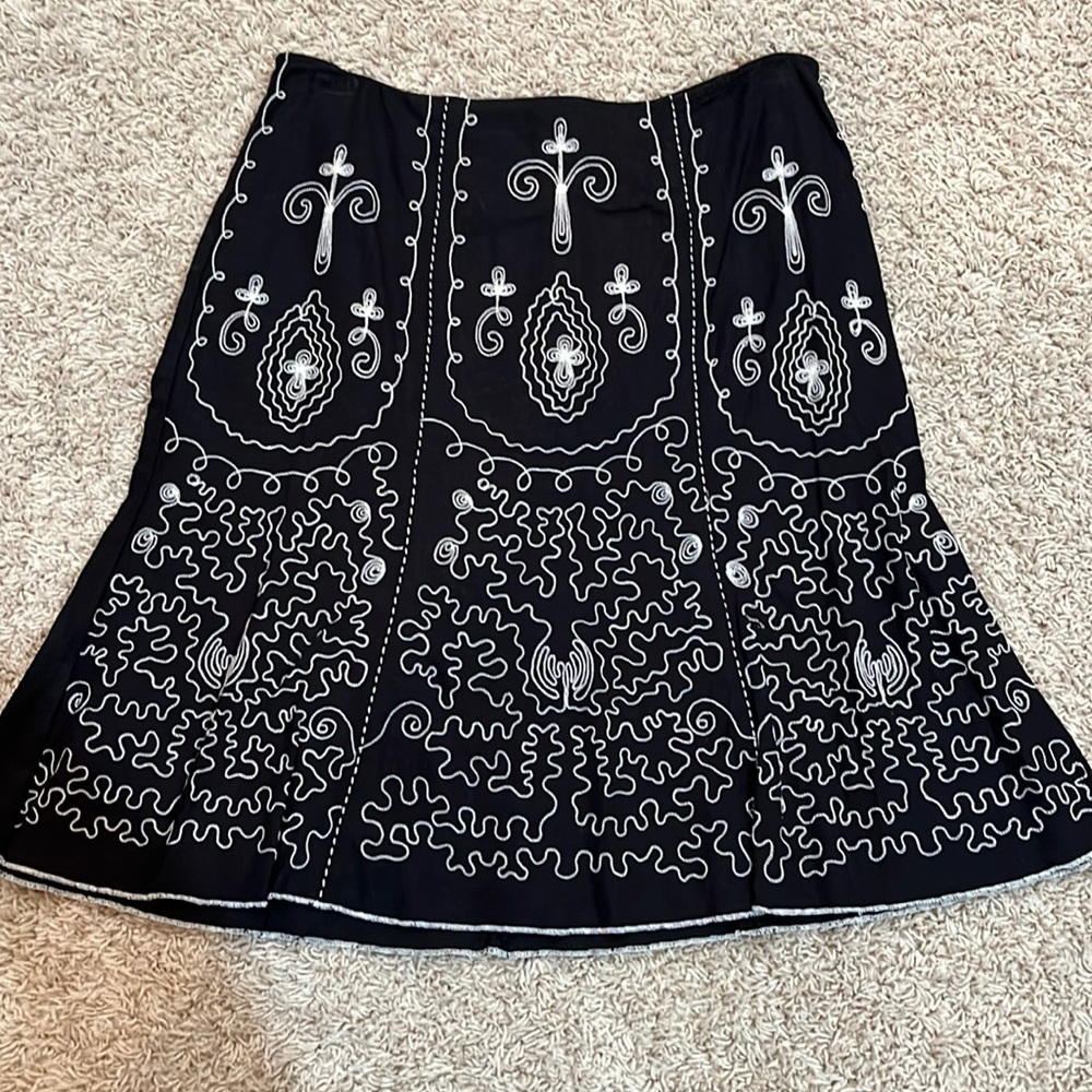 Women’s/Junior’s black skirt with embroidered stitching on front.  Size 7